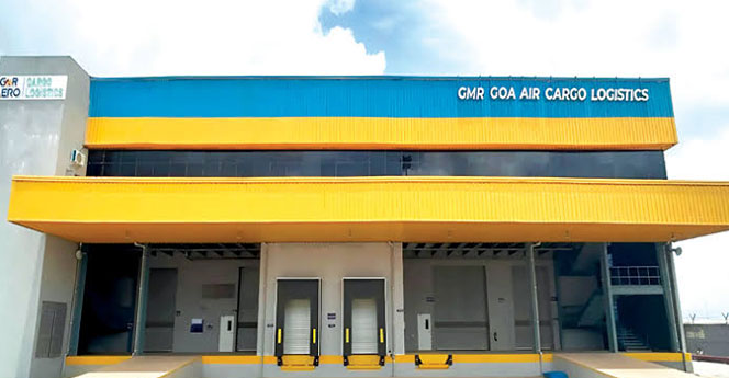 Front view of GMR Goa Air Cargo Logistics terminal with loading bays, showcasing modern air freight infrastructure and cargo handling facility.