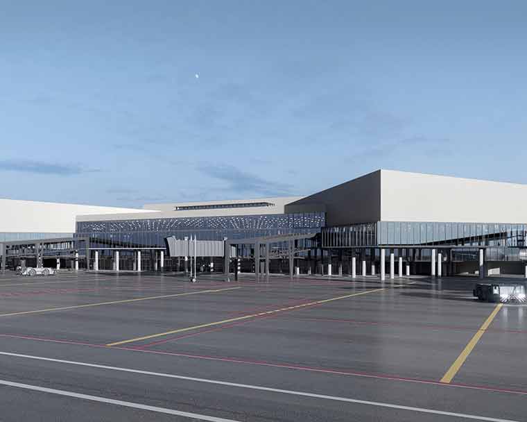 Exterior view of a modern airport terminal with jet bridges and aircraft service areas, showcasing contemporary aviation infrastructure and passenger handling facilities.